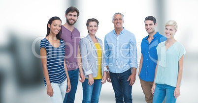 Portrait of happy friends standing against blurred background