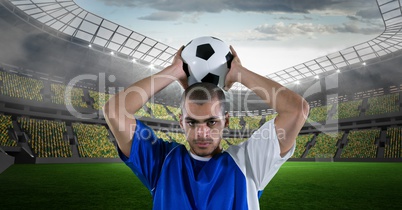 Confident man throwing soccer ball