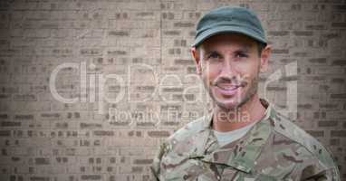 Soldier against brown brick wall