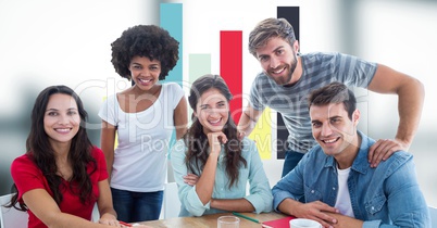 Casual business people smiling against graph