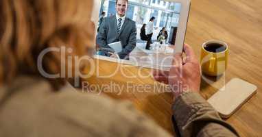 Businesswoman having video call with colleague on tablet PC