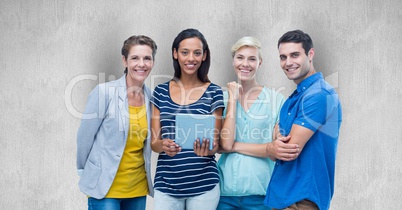 Portrait of happy friends with digital tablet against gray background