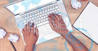 Hands using laptop with overlays