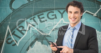 Smiling businessman with smart phone against strategy clock
