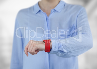 Midsection of businesswoman wearing smartwatch