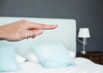 Hand pointing in  air of bedroom