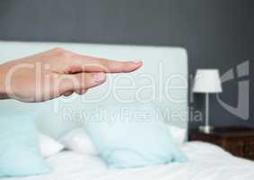 Hand pointing in  air of bedroom
