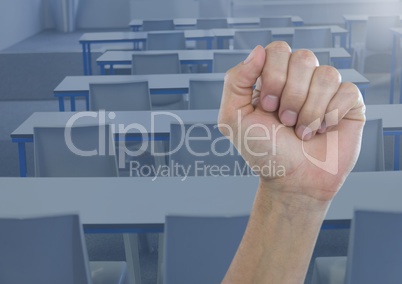 Hand in fist in classroom