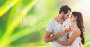 Loving couple holding champagne flutes outdoors