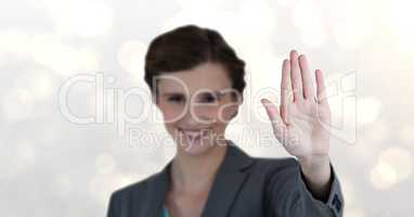Smiling businesswoman showing stop gesture