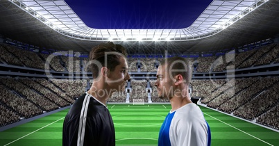 Sportsmen looking at each other on soccer field