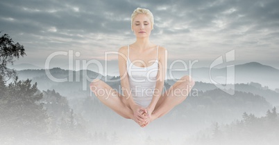 Double exposure of woman over mountains in foggy weather