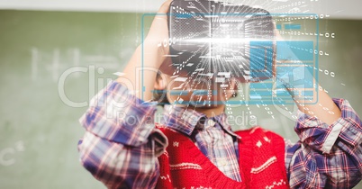 Digital composite image of tech graphs with man using VR glasses in background