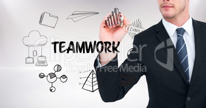 Midsection of businessman drawing icons of teamwork