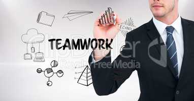 Midsection of businessman drawing icons of teamwork