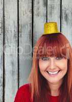Happy redhead female wearing small hat
