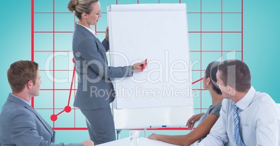 Woman giving presentation to colleagues against graph