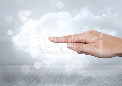 Hand pointing in  air of sparkling lights and cloud