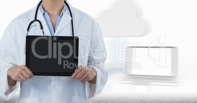 Doctor mid section with tablet against blurry screens