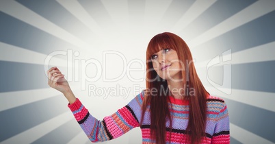 Redhead woman gesturing against illuminated background
