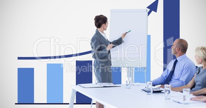 Businesswoman giving presentation to colleagues against graph