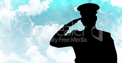 Captain silhouette saluting against blue sky