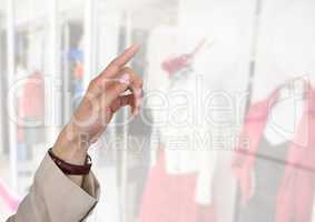 Hand pointing in  air of clothes retail shop