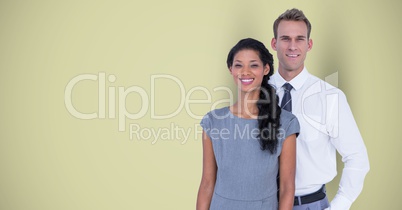 Portrait of confident business colleagues standing against green background