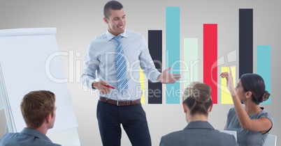 Business people discussing against graph