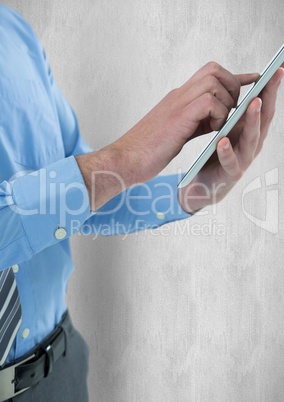 Midsection of businessman using tablet PC
