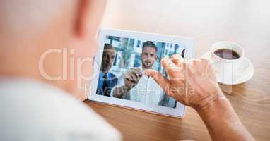 Cropped image of businessman video conferencing with partners on tablet PC
