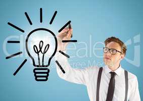 Business man drawing lightbulb doodle with flare against blue background