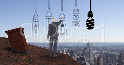 Businessman drawing various lighting equipment while standing on roof