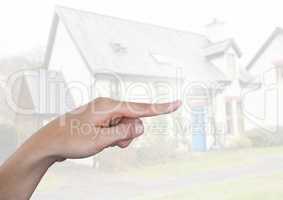 Hand pointing in  air of outside house