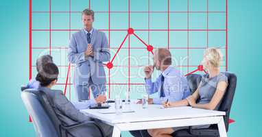 Businessman explaining colleagues in meeting with graph in background