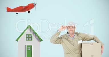 Delivery man with parcel by house and airplane