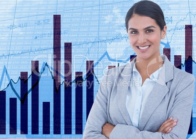 Businesswoman with arms crossed against graphs