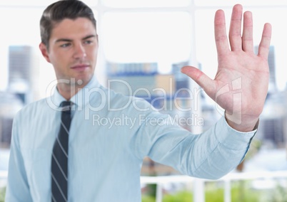 Confident businessman touching screen