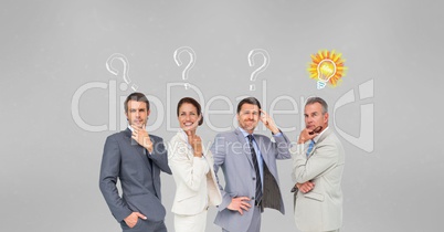 Confused business people with question marks and light bulb