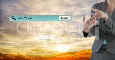 Businesswoman touching transparent digital tablet by search bar against cloudy sky
