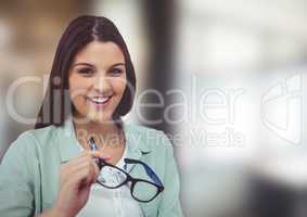 Portrait of happy woman holding eyeglasses