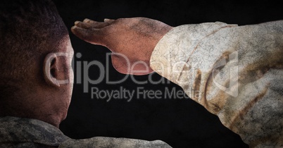 Back of soldier saluting against black background with grunge overlay