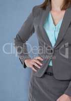 Midsection of businesswoman standing with hand on hip