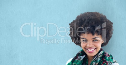 Portrait of happy female hipster against blue background
