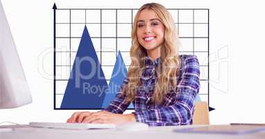 Smiling businesswoman against graph in office