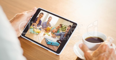 Hand video conferencing with team on tablet PC