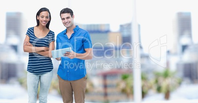 Business people with digital tablet standing outdoors