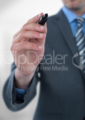 Midsection of businessman holding felt tip pen