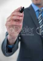 Midsection of businessman holding felt tip pen