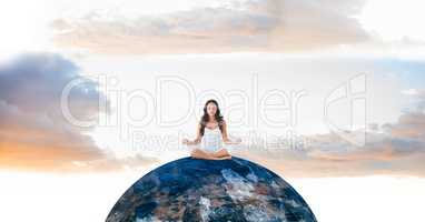 Woman meditating on globe